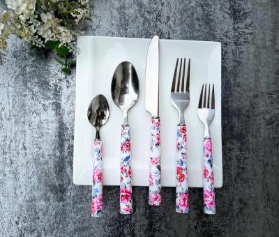 China Sustainable 20 Pieces Stainless Steel Flatware Cutlery Set With Plastic Handle Flower Printing for sale