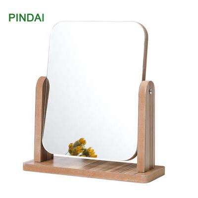 China Wooden Frame Design Double Sided Rectangle Shape Rotating Makeup Vanity Rack Table Mirror for sale