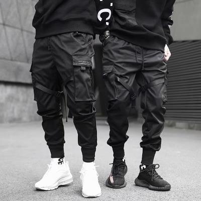 China Viable Men Slim Cargo Pants High Street Style Male Cargo Pants 5XL Big Pockets Suspenders Black Casual Sweatpants Fashion New for sale