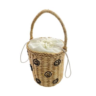 China Summer Soft Professional Handmade Straw Embroidery Smile Designer Style Tote Handbags Clutch Basket Beach Woven Bucket Weaving Luxury Bag for sale