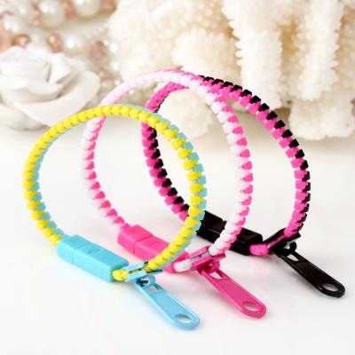 China Hot Zipper Amazon Reliever 7.5 Inch Stirrup Bracelets Two Tone Wristbands Stir Sensory Toys for sale