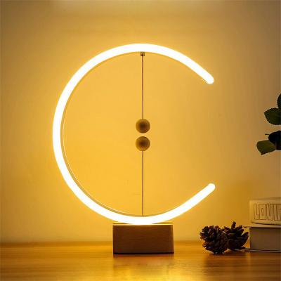 China Modern Drop Shipping Creative Balance Lamp Bedroom Bedside Table Lights Magnetic LED Desk Lamp Kids Gifts Ball Switch Led for sale