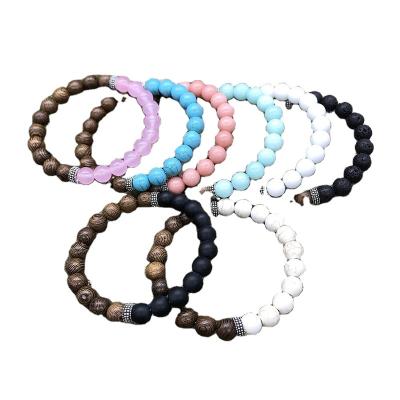 China Hot-selling FASHIONABLE Amazon chicken wing bead classic wood bracelet 8mm natural stone volcanic stone wooden bracelet for sale