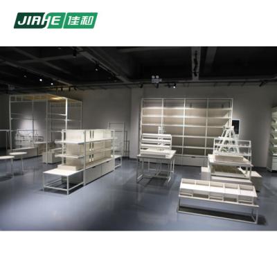 China Double Sided Wood And Steel Combination Cosmetic Shop Store Fittings Textile Multifunctional Display Racks for sale