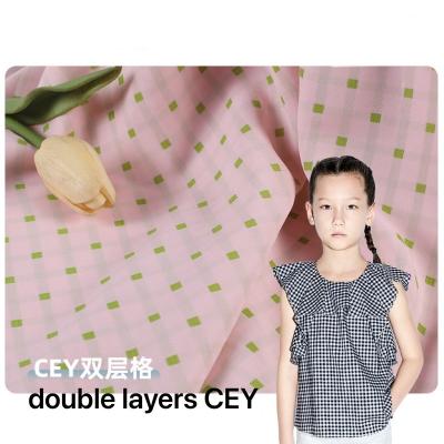 China Shrink-Resistant In Stock 210gsm Double Layer CEY Grid Fabric Fashion Kids Plaid Shirt Fabric for sale