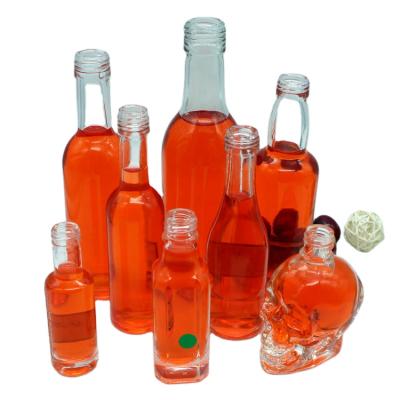 China Mini Glass Wine Bottles Clear Liquid Custom Empty Glass Bottle For Liquor for sale