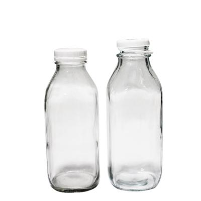 China Beverage beverage factory produced 32oz glass milk bottle milk jars with lids in stock for sale