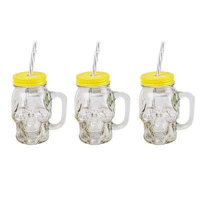 China Custom Heatable Heatable Glass Jar for Juice Skull Shape Glass Container with Handle and Lids and Straw for sale