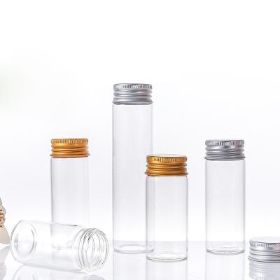 China 2023 New Trend Tubular Glass Food Packaging Bottles With Gold Silver Aluminum Screw Cap Clear Glass Jars for sale