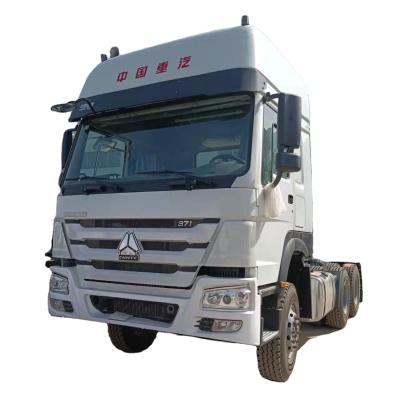 中国 Good quality used Howo trucks refurbished Sinotruk tractor head price 販売のため