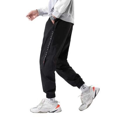 China Anti-wrinkle street trend hip-hop jogging new loose casual pants beam foot track pants for sale