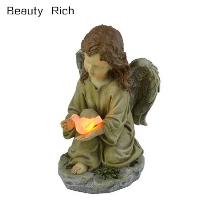 China Europe LED Solar Fairy Garden Decor Angel With Glowing Dove Design Garden Statue for sale