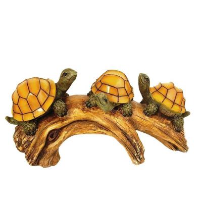 China Solar Powered Garden Polyresin Garden Turtles On Log Decoration for sale