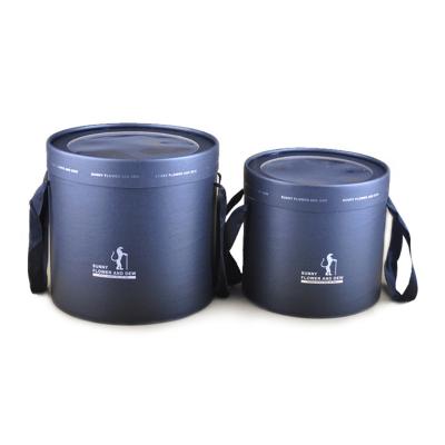 China Recycled Materials Round Box With Window Rose Black Paper Flower Gift Box Packaging Cylinder With Handle for sale