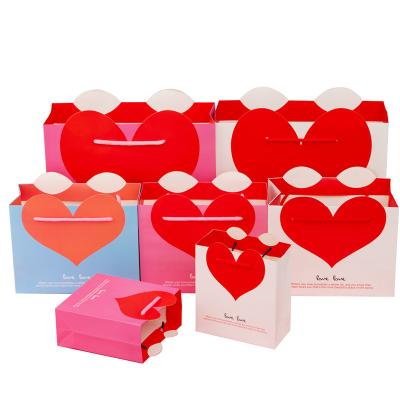 China Logo Packaging Hair Jewelry Heart Shape Recyclable Custom Paper Bag Personalized Paper Bag for sale