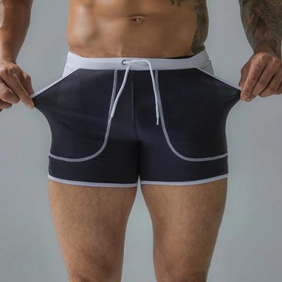 China Men Swimming Suits Breathable Shorts With Rope High Waist With Pockets Swimsuit Sports Quick Dry Trunk Swim Jammer In Solid Colors for sale