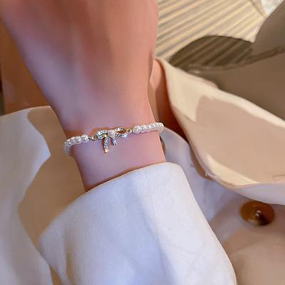 China CLASSIC baroque savory pearl shining Diamond Bow rhinestone arc round Bracelet Girl Stylish pearls bracelet for sale