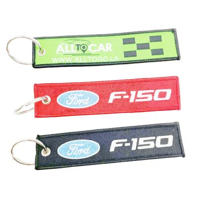 China New Promotion Label Key Chain Air Chain Embroidered LOGO Double Sided Woven Pendant Woven Key Chain for sale