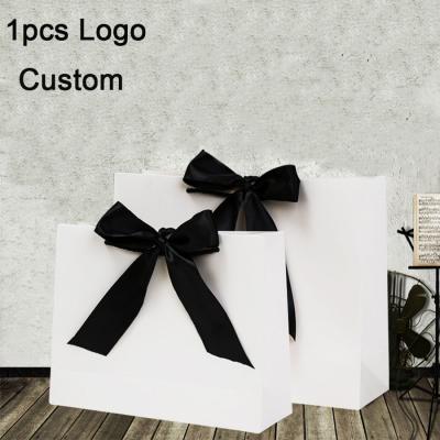 China 1pcs Recyclable Cosmetic Packaging Bow Gift Bags Logo Print Paper Bags Clothing Bolsa Personalizada for sale