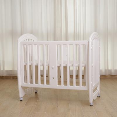 China Modern Standard Multi-Function Baby Crib Table Flip High Quality Children Push In Baby Crib Splicing Newborn Hutch for sale