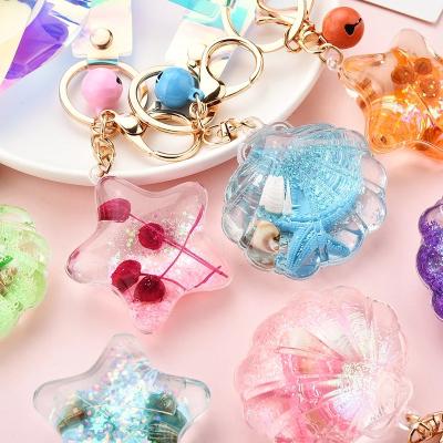 China Cute/Romantic Liquid Acrylic Quicksand Keychain Glitter Starfish Keychain Backpack Keychain Pendant Couples Women Men Boyfriend Keychains Gift for sale