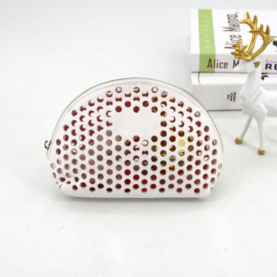 China Fashionable Custom Made Travel PU Logo Travel Laser Cut Pouch Cosmetic Toiletry Bag for sale