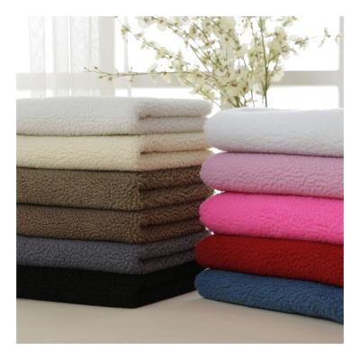 China Good Price 100% Polyester Soft Boucle Fleece Waterproof Double Sided White Curly Textile Fabric for sale