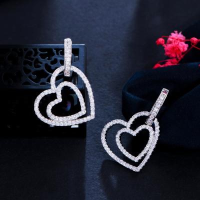 China Sparkle Micro Pave Zircon Cute Double Heart Shape Huggie Circle Earrings For Women New Trendy Ear Jewelry 2021 for sale