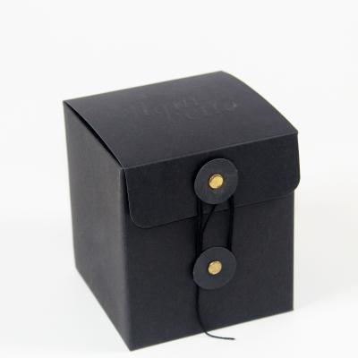 China Custom Black Paperboard Box Embossed Logo For Candles With Eyelets And Ribbons for sale