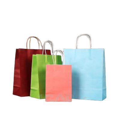 China Recyclable Kraft Paper Bag With Handles For Wedding Party Fashionable Clothing Gifts Multifunctional Wholesale for sale