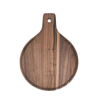 China Sustainable American Round Walnut Paddle Pizza Serving Cutting Board for sale