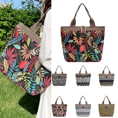 China New portable wholesale multicolor large capacity printed canvas shoulder bag casual shopping handbag for women and girls for sale