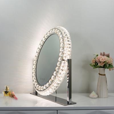 China Hollywood Crystal Makeup Mirror Lighted Bedroom Decoration Table Oval Vanity With Led Lights for sale