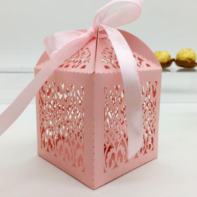 China Beautiful and Decorative Recyclable Pink Fence Paper Laser Cut Wedding Candy Box Chocolate Favor Box Baby Birthday Gift Box for sale