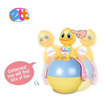 China Toy Battery Musical Powered Chubby Baby Rattles Tumbler Dolls Toy With Light Music for sale