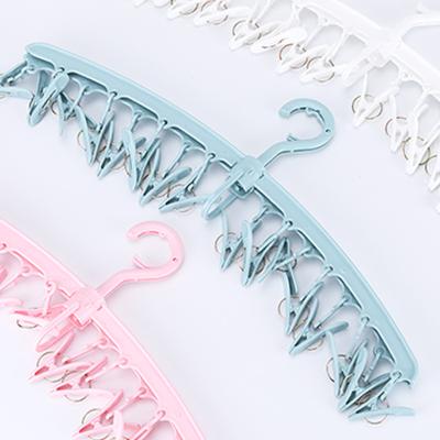 China Modern Foldable Magic Hangers For Clothing Multifunctional Plastic Clothes Hanger Socks Clips Pants Hanger for sale