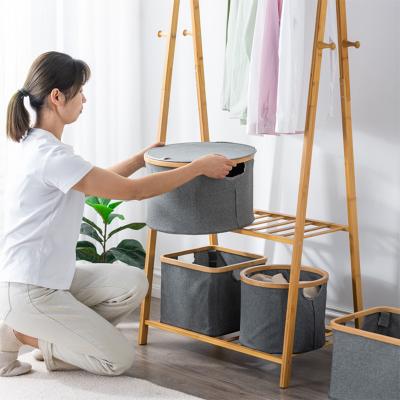 China Viable Round Bamboo Fabric Storage Basket Foldable Tray Collect Clothes Decoration Storage Box for sale