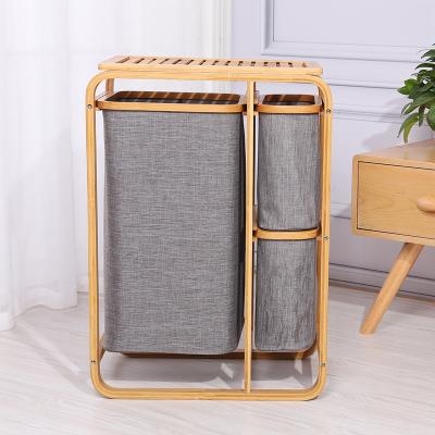 China Cesta moderne de almacenamiento Bathroom Gray Bamboo Oxford Cloth 3 Dividers Laundry Basket Laundry Hamper Storage Holders and Racks for sale