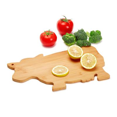 China Viable Bamboo Cute Dinner Kitchen Cow Shaped Mini Cheese Board Vegetable Cutting Board for sale