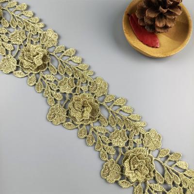 China New viable wholesale special design gold ribbon lace trim high quality dress embroidery lace for sale