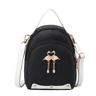 China New PORTABLE Rivet Lychee Pattern Backpacks Little Swan Shape Pendant Backpack for sale