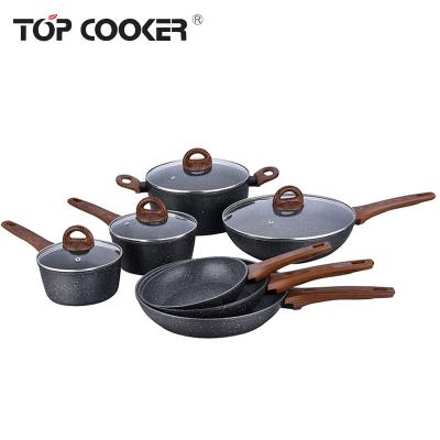 China Wodden Sustainable Design Forged Non Stick Liner Marble Cookware Set for sale