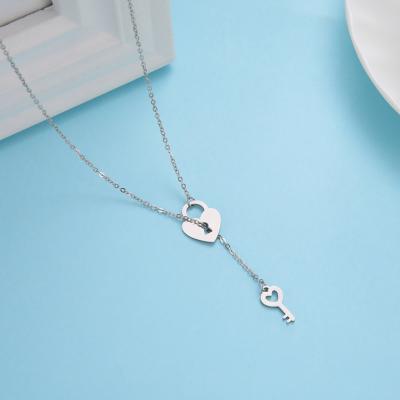 China Fashionable Wholesale Simple Choker Jewelry RTS Stainless Steel Heart Lock Key Pendant Necklace With Hollow Heart Metal Jewelry for sale