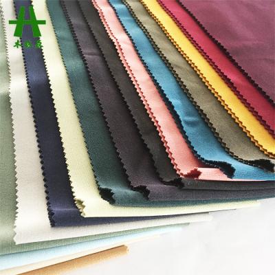 China Stretch Mulinsen Textile Knitted Polyester 4 Way Single Dyed Stretch King Roma Fabric Factory for sale