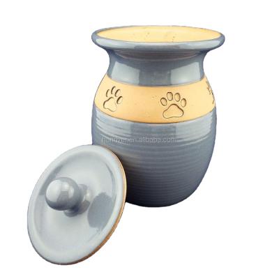 China Hot Sell Stocked Unique Customize Ceramic Pet Cremation Urn With Hand Painting Paw Print For Dog for sale