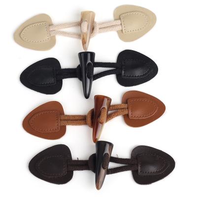 China Unique Dry Clean Design Sew On Genuine Leather Coat PU Closure Toggle Button for sale