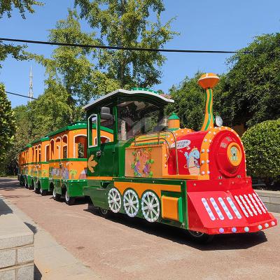 China Wooden Amusement Equipment Green Battery Rides Battery Indoor Outdoor Guided Electric Dinosaur Forest Electric Train for sale