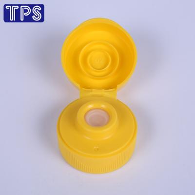 China Non Spill Traditional 31-400 Flip Top Cap With Silicone Valve, With Induction Seal Coating for sale