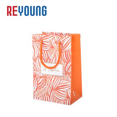 China Recycled Materials Customized Small Decorative Cute Gift Packaging Paper Bags With Handles for sale