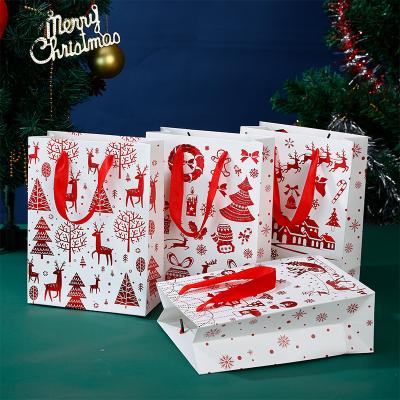 China Recycled Materials REYOUNG Santa Big Clothing Bag Shipping Large Christmas Gift Custom Paper Bags for sale